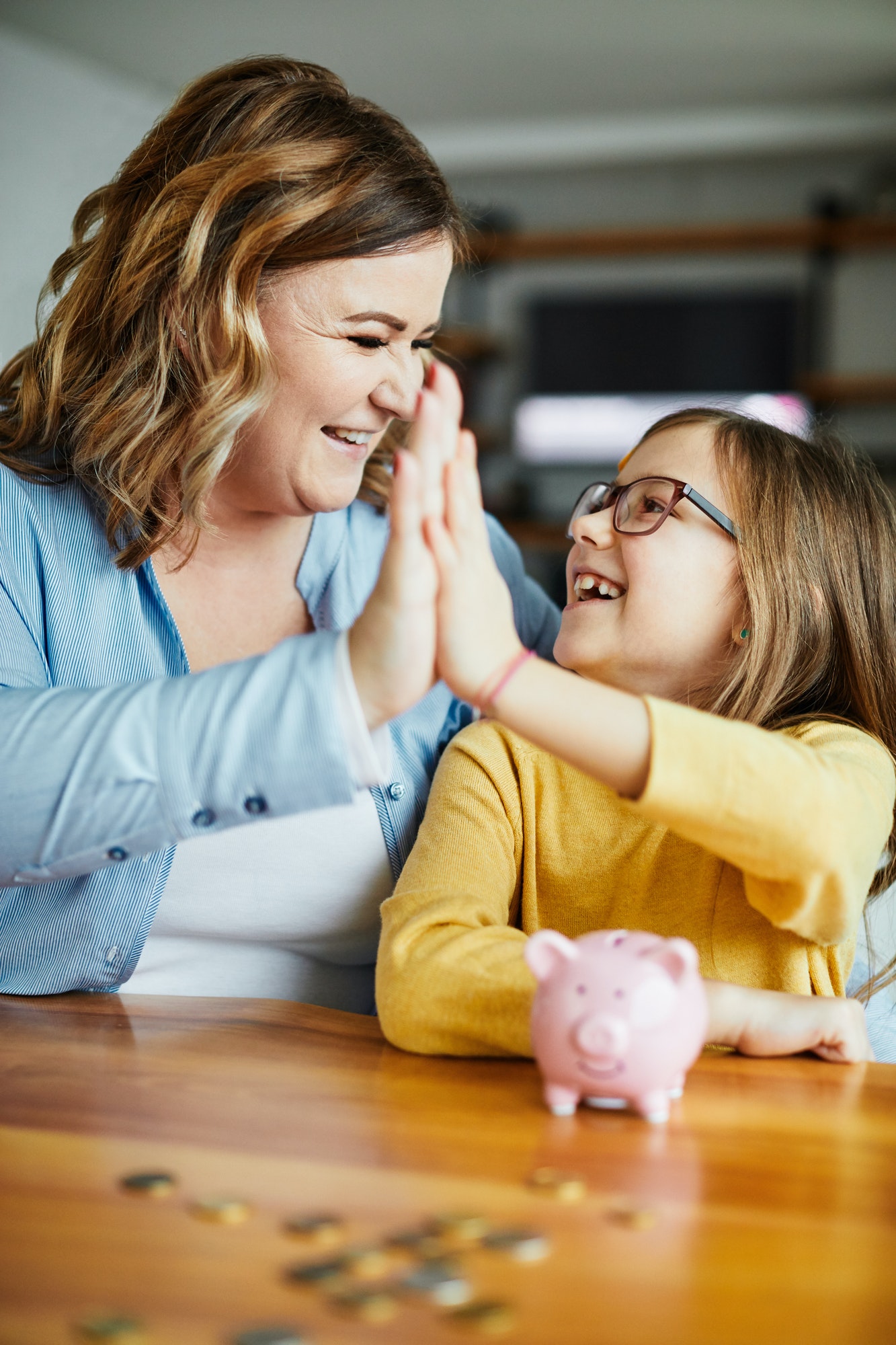 piggy bank mother daughter money savings coin finance child family happy investment